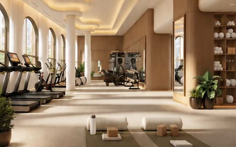 A fitness room visualization with cardio machines beneath arched windows